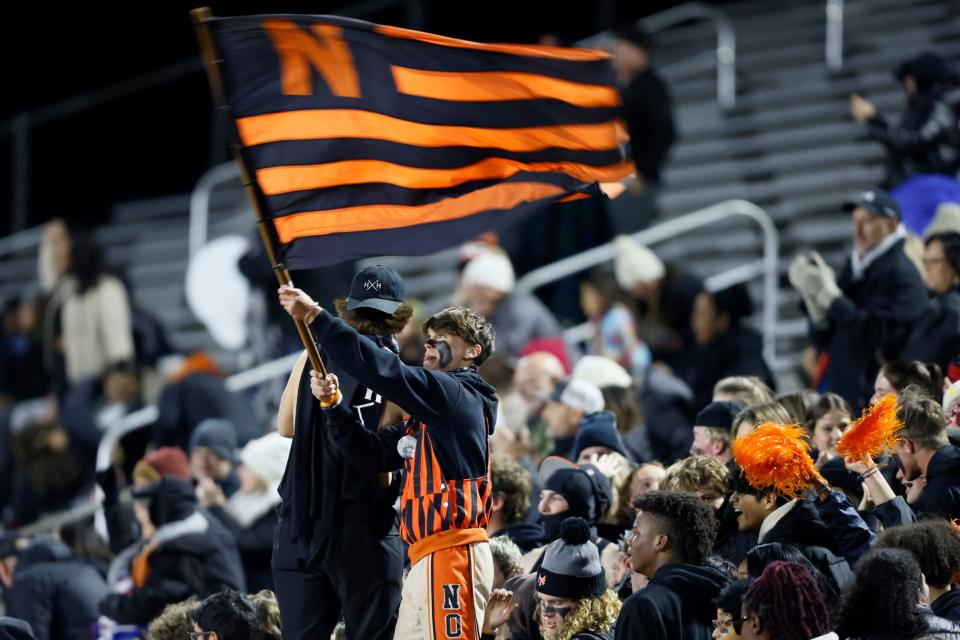 Norman fans cheer during a high school football game between Norman and Broken Arrow in the first round of the Class 6A-1 playoffs in Norman, Okla., Thursday, Nov. 9, 2023.