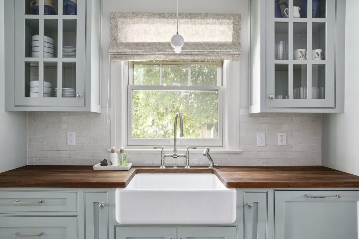 a kitchen with white cabinets