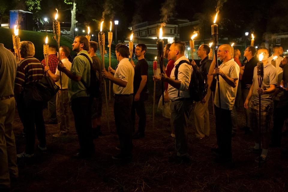 <p>Neo Nazis, Alt-Right, and White Supremacists march through the University of Virginia Campus with torches in Charlottesville, Va., on Aug. 11, 2017. (Photo: Samuel Corum/Anadolu Agency/Getty Images) </p>