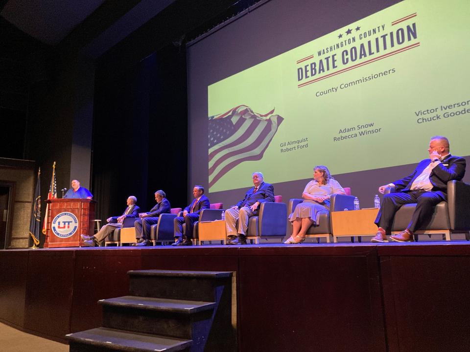 Candidates for the Washington County Commission are introduced by moderator Chris Reed during a Washington County Debate Coalition debate at Utah Tech University.