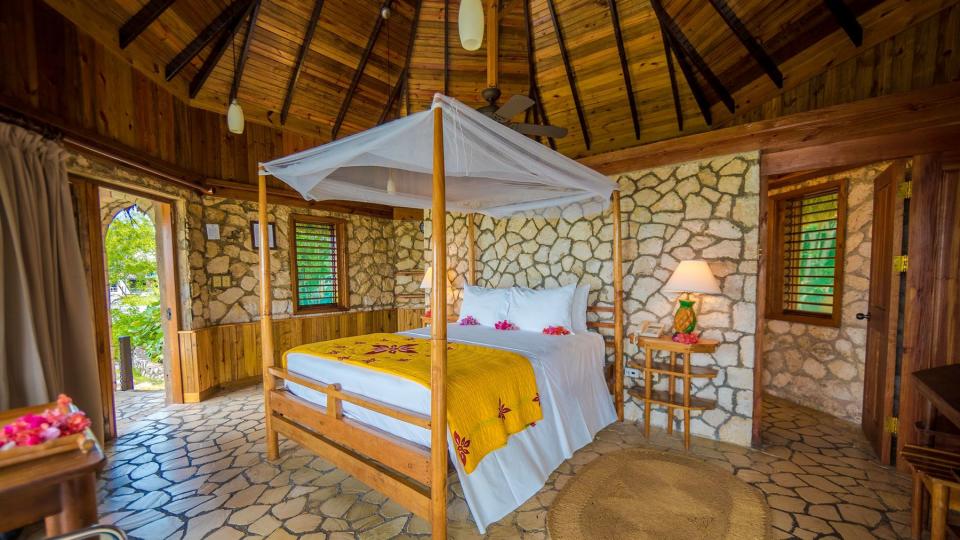 Rockhouse Resort &amp; Spa hotel room with canopy bed