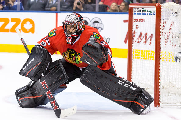 TORONTO, ON - MARCH 18: Corey Crawford #50 of the Chicago Blackhawks keeps his eyes on the puck against the Toronto Maple Leafs during the third period at the Air Canada Centre on March 18, 2017 in Toronto, Ontario, Canada. (Photo by Kevin Sousa/NHLI via Getty Images)