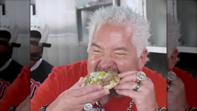 Guy Fieri eating