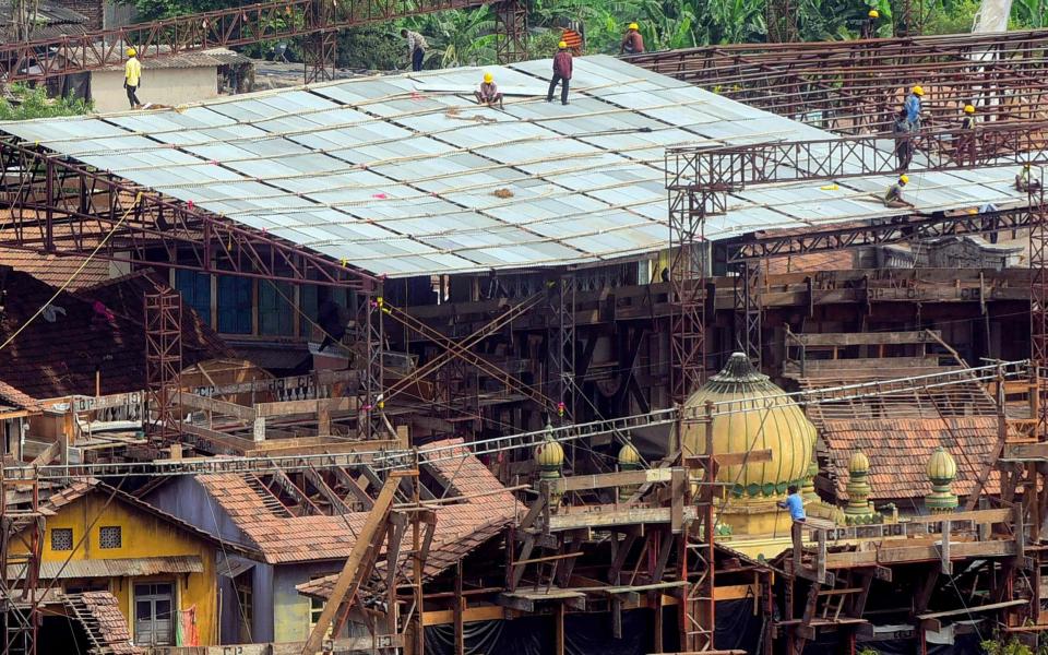 Workers break down a set inside Film City, Mumbai as restrictions were eased during the coronavirus lockdown on June 1 - AFP