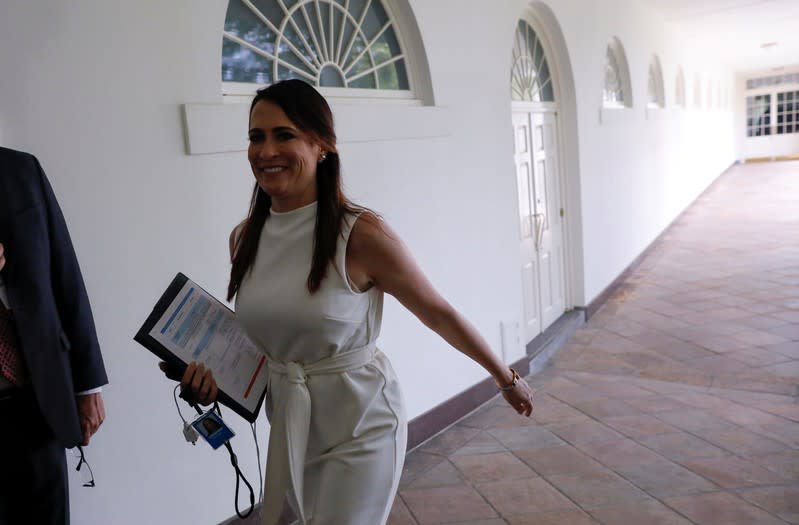 First lady communications director Stephanie Grisham walks at the White House in Washington
