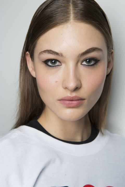 <p>If you're more of a New Years house party than a going out out kind of gal, then a ring of artfully smudged eyeliner and precise centre-parted hair is the make-up look for you.</p>