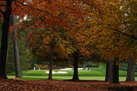 Rory McIlroy, of Northern Ireland, Phil Mickelson , Dustin Johnson and Xander Schaufele play on the 12th green during a practice round for the Masters golf tournament Tuesday, Nov. 10, 2020, in Augusta, Ga. (AP Photo/Matt Slocum)