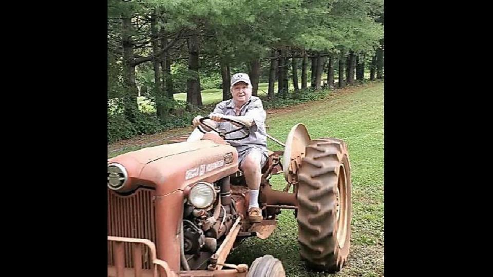 Freddy Pope rode his tractor at the gardens he tended to outside his Statesville-area home.