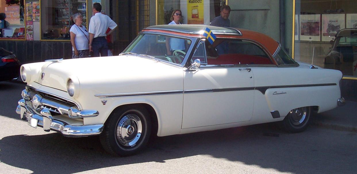 White 1954 Ford Crestline Skyliner with Swedish flag