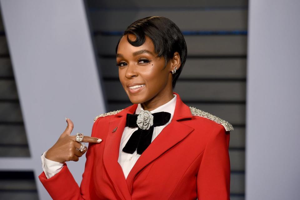 <p>Update your short black pixie with a single curl like singer <strong>Janelle </strong><strong>Monáe.</strong> Shape the curl by using hair wax or your favorite edge control product.</p>