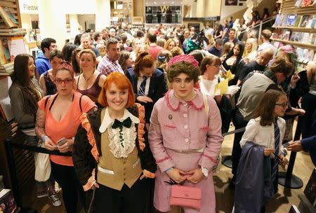 Fans queue to receive a copy of the book of the play of Harry Potter and the Cursed Child parts One and Two at a bookstore in London, Britain July 30, 2016. REUTERS/Neil Hall