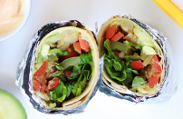 <p>To avoid the pain of firing up the grill or stove, this burrito recipe is meat-free. You’ll need the usual suspects like tomatoes, avocado, black beans and tortillas. Top it with the recommended dressing or try making it with this Chipotle <a href="https://www.thedailymeal.com/cook/fast-food-copycat-recipes-chipotle-taco-bell?referrer=yahoo&category=beauty_food&include_utm=1&utm_medium=referral&utm_source=yahoo&utm_campaign=feed" rel="nofollow noopener" target="_blank" data-ylk="slk:copycat recipe;elm:context_link;itc:0;sec:content-canvas" class="link ">copycat recipe</a> for honey vinaigrette dressing.</p> <p><a href="https://www.thedailymeal.com/best-recipes/avocado-black-bean-burrito?referrer=yahoo&category=beauty_food&include_utm=1&utm_medium=referral&utm_source=yahoo&utm_campaign=feed" rel="nofollow noopener" target="_blank" data-ylk="slk:For the Avocado and Black Bean Burrito recipe, click here;elm:context_link;itc:0;sec:content-canvas" class="link ">For the Avocado and Black Bean Burrito recipe, click here</a>.</p>