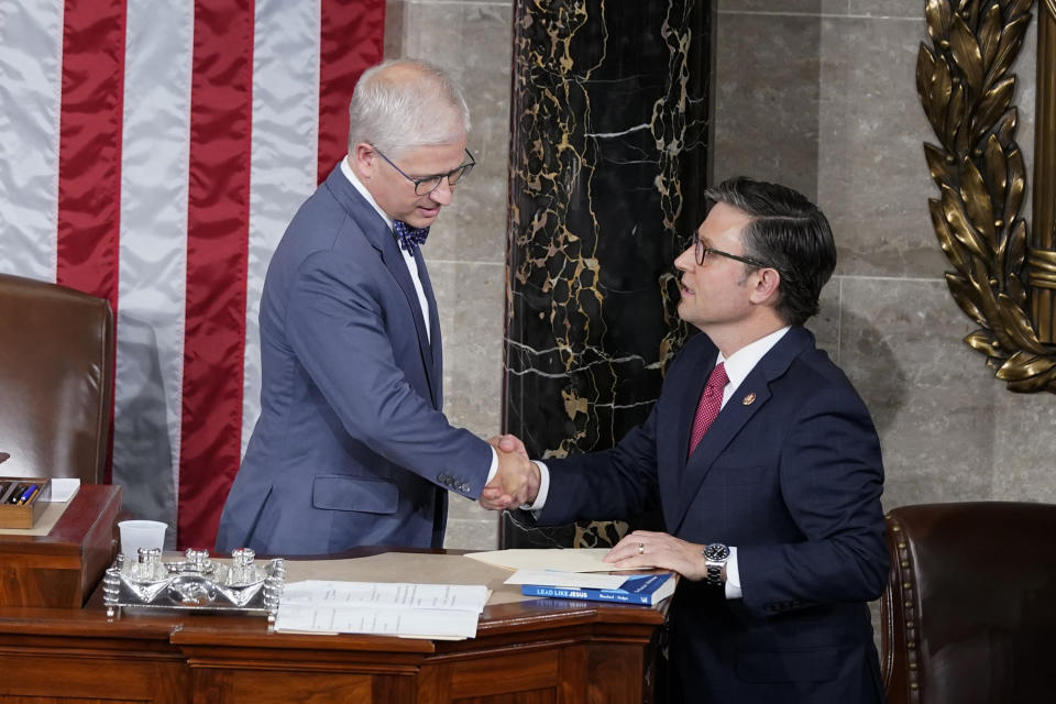 FILE - Temporary House speaker Rep. Patrick McHenry, R-N.C., talks with Rep. Mike Johnson, R-La., before Republicans try to elect Johnson to be the new House speaker, at the Capitol in Washington, Oct. 25, 2023. As Johnson tries to unite the slim House Republican majority, he's fast running into the same hard-right factions and divisions that his predecessor, Kevin McCarthy was unable to tame. It's disrupting the GOP agenda, shelving priorities and leaving gnawing questions about any leader's ability to govern. (AP Photo/Alex Brandon, File)