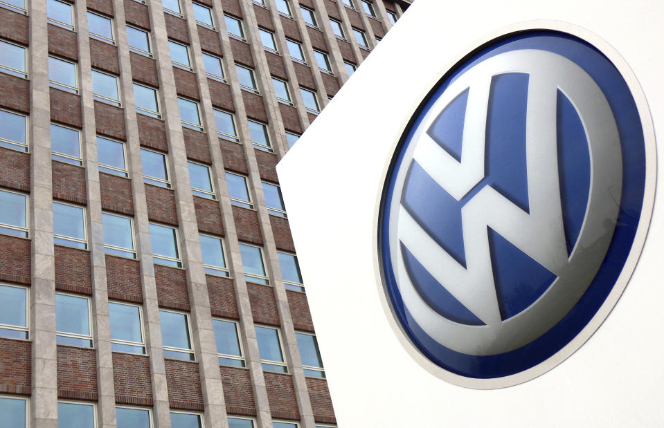 FILE - In this Friday, April 13, 2018 file photo, Volkswagen logo is pictured in front of a company building in Wolfsburg, Germany. German carmaker Volkswagen reports second-quarter earnings on Wednesday Aug 1, 2018. (AP Photo/Michael Sohn, File)