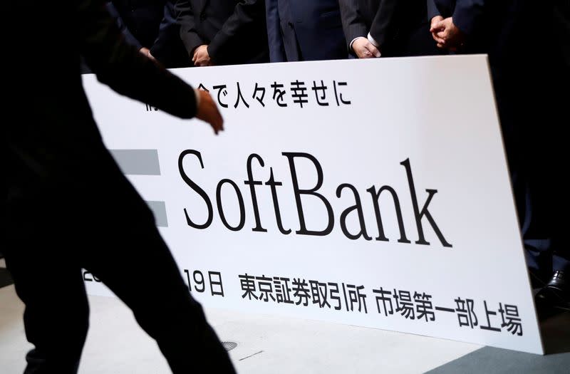 FILE PHOTO: SoftBank Corp. placard is prepared during a ceremony to mark the company's debut on the Tokyo Stock Exchange in Tokyo