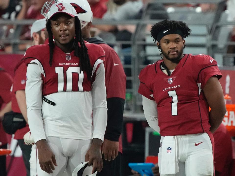 DeAndre Hopkins and Kyler Murray stand next to each other on the sideline of Cardinals preseason game.