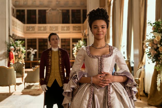 Sam Clemmett as Young Brimsley and India Amarteifio as Young Queen Charlotte in 