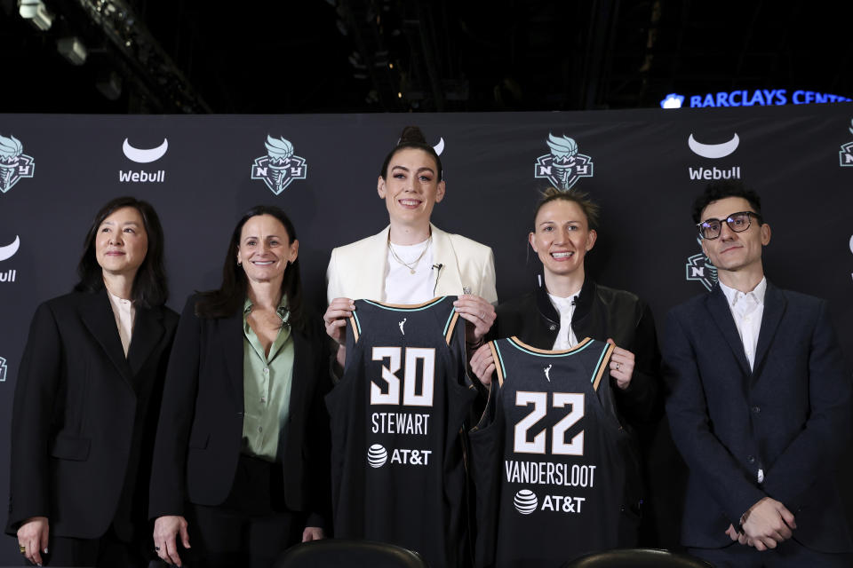 New York Liberty team owner Clara Wu Tsai, head coach Sandy Brondello, forward Breanna Stewart, guard Courtney Vandersloot and general manager Jonathan Kolb pose during the players' introductory news conference in February. (AP Photo/Jessie Alcheh)