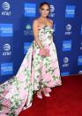 <p>The 50 year-old star wore a Richard Quinn floral ballgown to pick up the Spotlight Award for her role in hit <a href="https://www.elle.com/uk/life-and-culture/a30177996/jennifer-lopez-reaction-to-fan-hustlers-plane/" rel="nofollow noopener" target="_blank" data-ylk="slk:Hustlers;elm:context_link;itc:0;sec:content-canvas" class="link ">Hustlers</a>. </p><p>Alongside her matching clutch and court heels the mother-of-two wore her hair in a large bun that totally reminded us of her character's iconic hairdo' in <a href="https://www.elle.com/uk/beauty/hair/a30387537/jennifer-lopez-hair-maid-in-manhattan/" rel="nofollow noopener" target="_blank" data-ylk="slk:Maid In Manhattan;elm:context_link;itc:0;sec:content-canvas" class="link ">Maid In Manhattan</a>. </p>