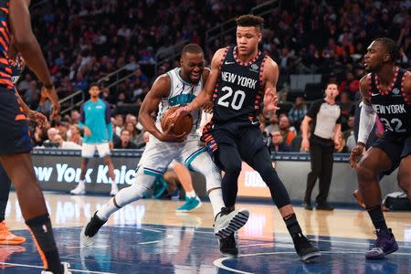 Dec 9, 2018; New York, NY, USA; Charlotte Hornets guard Kemba Walker (15) drives the ball past New York Knicks forward Kevin Knox (20) in the second quarter at Madison Square Garden. Catalina Fragoso-USA TODAY Sports