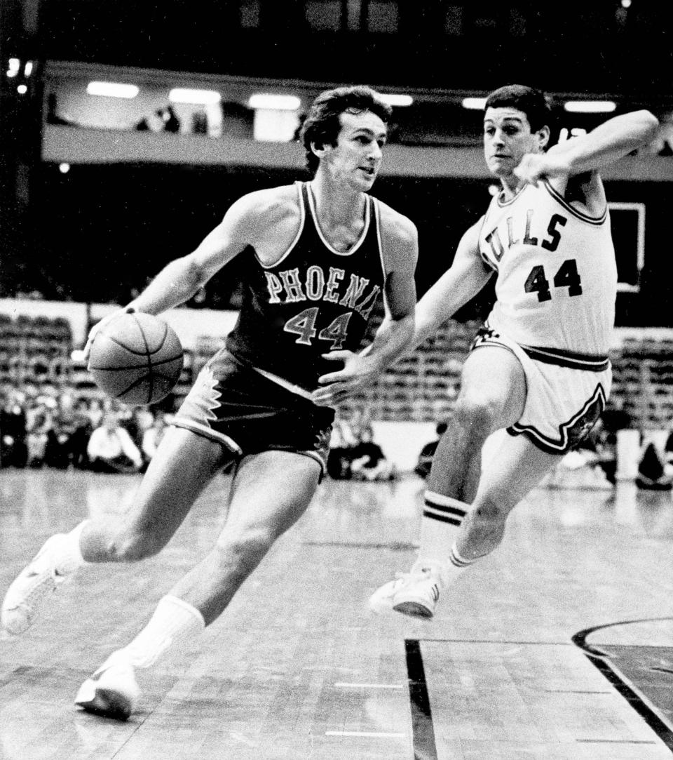 FILE - In this Jan. 12, 1976 file photo, Phoenix Suns' Paul Westphal (44) drives toward the basket as Chicago Bulls' Tom Kropp (44) makes an effort to block his advance during NBA basketball game in Chicago. Westphal, the Hall of Fame basketball player has died. The Phoenix Suns confirmed his death Saturday, Jan. 2, 2021. (AP Photo/Fred Jewell)