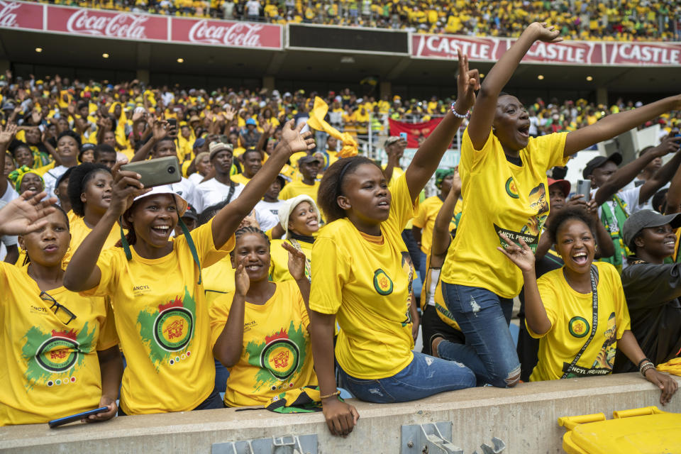 File - African National Congress (ANC) supporters wearing logo-clad t-shirts cheer South African President Cyril Ramaphosa at the party's manifesto launch in Durban, South Africa, Saturday, Feb. 24, 2024. The ANC lost a second court case against the uMkhonto weSizwe (MK) rival party led by former President Jacob Zuma on Monday, April 22, 2024, when a judge dismissed the ANC's case alleging copyright infringement against the MK Party for using a name and a logo. (AP Photo/Jerome Delay, file)