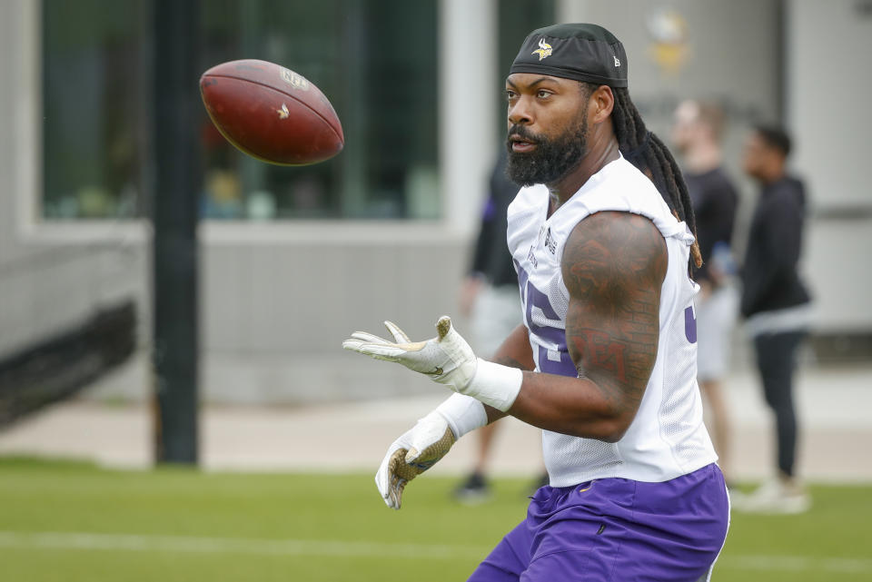 FILE - Minnesota Vikings linebacker Za'Darius Smith takes part in drills at the NFL football team's practice facility in Eagan, Minn., Tuesday, May 17, 2022. Smith signed this year with the Minnesota Vikings, after a back injury last season and his subsequent release by the Green Bay Packers created a fresh start with a formerly rival team. Smith's first opportunity for revenge comes right away, with the Packers visiting the Vikings in Week 1. (AP Photo/Bruce Kluckhohn, File)