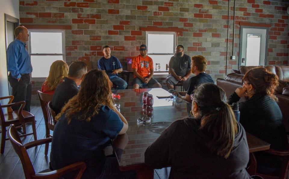Dan Stott, left, and his employees, from left, Nathan Berryman, Chad Reno and Richie Pannell, host a Q&A session at Port Clinton Manufacturing Company during Ottawa County Teacher Business Boot Camp 2023 on June 9.