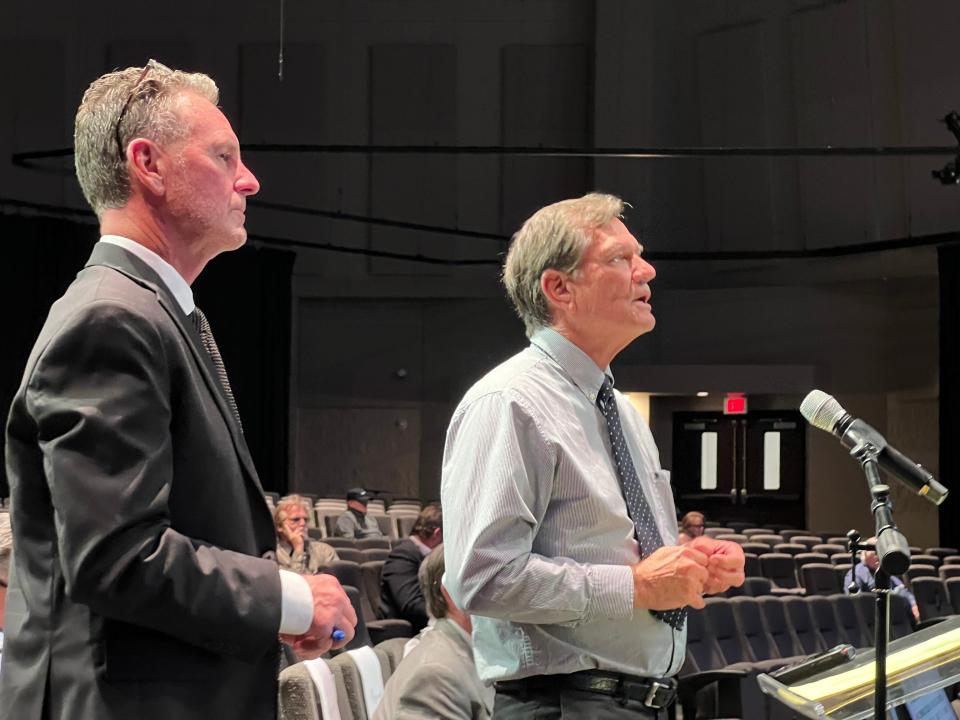 Developer Carl Velie, right, addresses the Ormond Beach City Commission about his and his partners' plans to convert the old Tomoka Oaks golf course into a 272-home gated community called Tomoka Reserve as his land-use attorney Rob Merrell looks on at the Commission meeting on Nov. 7, 2023.