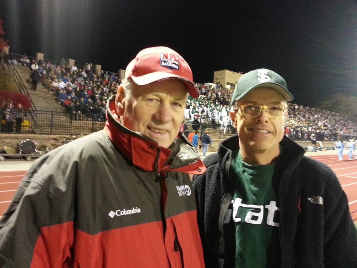 Reader John Dunham, right, and Len Dawson at a high school football game in Lawrence in 2013. Dunham and Dawson talked for nearly 20 minutes before the game started.