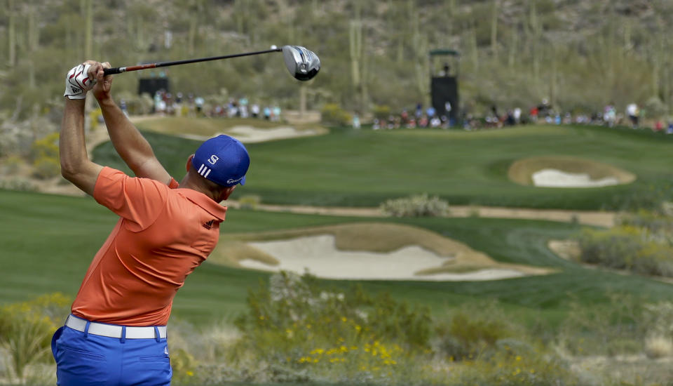 Sergio Garcia, of Spain, watches his tee shot on the 15th hole in his match against Rickie Fowler during the third round of the Match Play Championship golf tournament on Friday, Feb. 21, 2014, in Marana, Ariz. (AP Photo/Ted S. Warren)