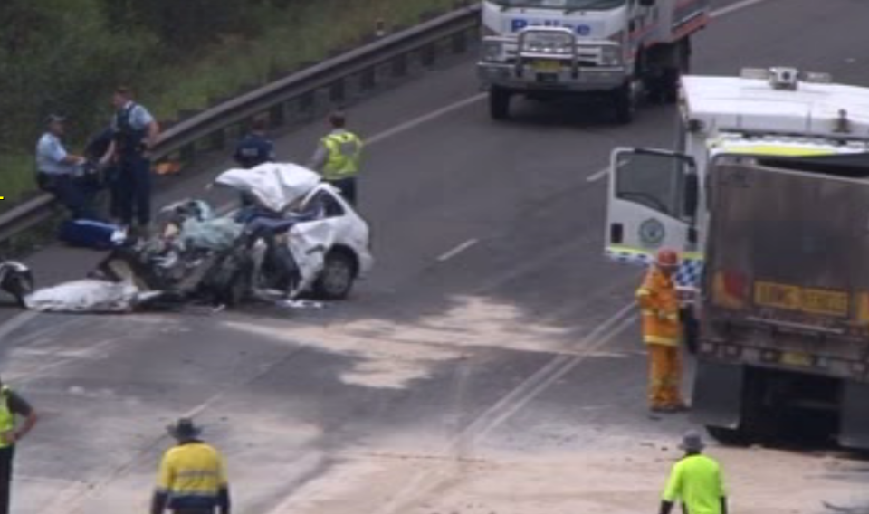 Appin Road has been blocked off after a car and a coal truck collided. Picture: 7 News