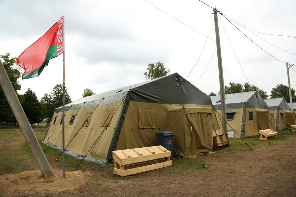The Belarusian flag flies above tents at a newly-built camp on a site previously used by the Belarusian army that could potentially accommodate up to 5,000 Wagner troops, on July 07, 2023, 90 kilometers southeast of Minsk, near Tsel, Asipovichy District, Belarus. (Photo by Adam Berry/Getty Images)