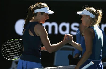 Tennis - Australian Open - Melbourne Park, Melbourne, Australia - 21/1/17 Britain's Johanna Konta shakes hands as she celebrates winning her Women's singles third round match against Denmark's Caroline Wozniacki. REUTERS/Issei Kato