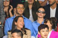 matching in blue with her friend at the Men's Singles Final.