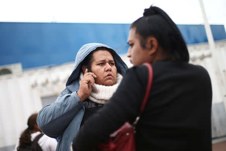 Members of a caravan of migrants from Central America wait to enter the United States border and customs facility, where they are expected to apply for asylum, in Tijuana, Mexico May 1, 2018. REUTERS/Edgard Garrido