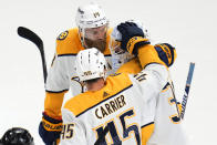 Nashville Predators goaltender Connor Ingram (39) is consoled by Mattias Ekholm (14) and Alexandre Carrier (45) after giving up an overtime goal to Colorado Avalanche defenseman Cale Makar in Game 2 of an NHL hockey Stanley Cup first-round playoff series Thursday, May 5, 2022, in Denver. The Avalanche won 2-1. (AP Photo/Jack Dempsey)