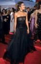 <p>This strapless tulle gown that Halle wore two decades ago still looks so modern and stylish today. She accessorized with a choker and pendant earrings to complete her Emmy's ensemble. </p>