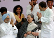 Former prime minister Manmohan Singh (L) is greeted by India's main opposition Congress party's vice-president Rahul Gandhi as the party's President Sonia Gandhi (C) looks on before what the party calls "Save Democracy" march to parliament in New Delhi, India, May 6, 2016. REUTERS/Altaf Hussain