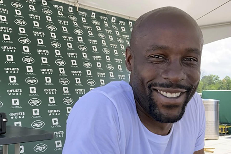 New York Jets special teams assistant coach Leon Washington speaks at the team's facility in Florham Park, N.J., on Aug. 26, 2022. Washington was a dynamic running back in the NFL and an All-Pro kick. His competitive nature has taken him from the playing fields to the sidelines as a coach. (AP Photo/Dennis Waszak Jr.)