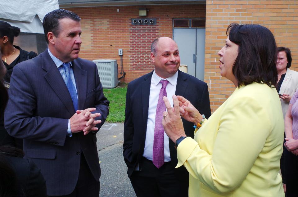 Brockton Mayor Robert Sullivan chats with Father Bill's President & CEO John Yazwinski and Massachusetts Lt. Govenor Kim Driscoll just prior to the speakers portion at the site of the soon to be built Father Bill's Homeless Shelter at the former Army Reserve Base near the Veteran's Administration building in Brockton on Wednesday, May 3, 2023.