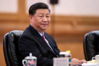 Chinese President Xi Jinping meets Ugandan President Yoweri Museveni at the Great Hall of the People in Beijing