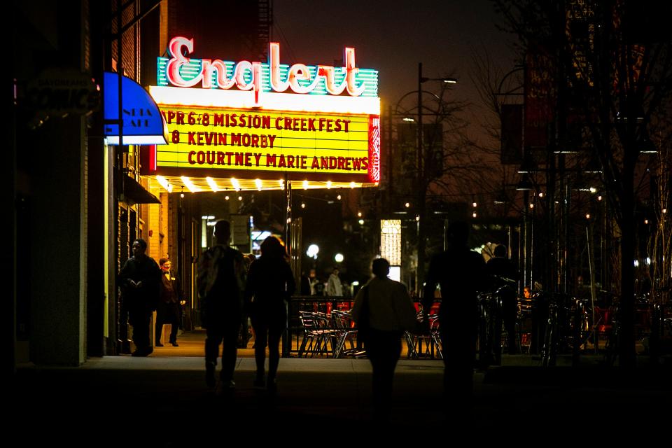 People walk towards the Englert Theatre during Mission Creek Festival, Friday, April 7, 2023, in Iowa City, Iowa.