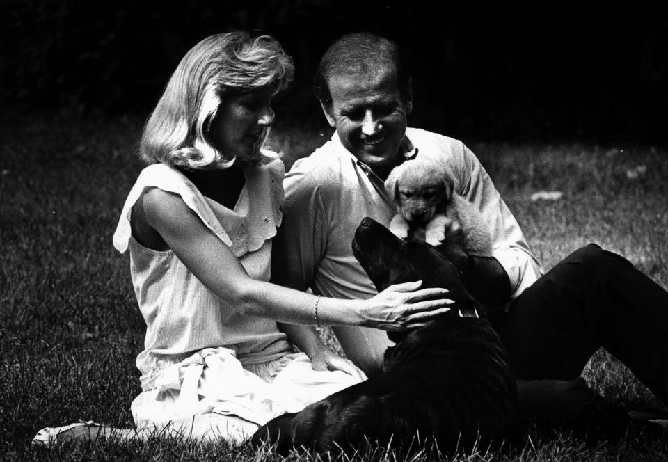 Jill Biden, left, and Joe Biden pet dogs August 3, 1986.