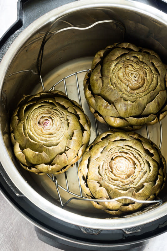 <p>Recipes From a Pantry</p><p>This Instant Pot Artichokes recipe is so quick and easy to make. Just two simple ingredients and minimal prep are all that’s needed to get tasty perfectly cooked artichokes that make a great appetizer or veggie to add to various dishes.</p><p><strong>Get the recipe: <a href="https://recipesfromapantry.com/instant-pot-artichokes/" rel="nofollow noopener" target="_blank" data-ylk="slk:Instant Pot Artichokes;elm:context_link;itc:0;sec:content-canvas" class="link rapid-noclick-resp">Instant Pot Artichokes</a></strong></p>