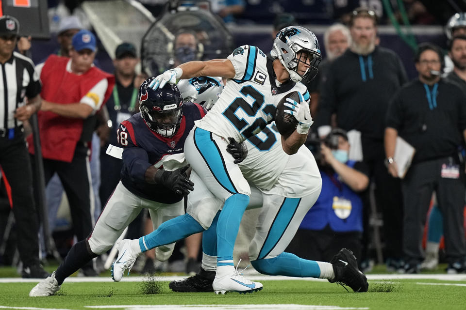 Carolina Panthers running back Christian McCaffrey (22) is tackled by Houston Texans linebacker Joe Thomas (48) during the first half of an NFL football game Thursday, Sept. 23, 2021, in Houston. (AP Photo/Eric Christian Smith)