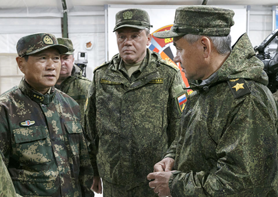 In this photo provided by Russian Defense Ministry Press Service on Wednesday, Sept. 12, 2018, Russian Defense Minister Sergei Shoigu, right, his Chinese counterpart, Gen. Wei Fenghe, left, and Russian Armed Forces Valery Gerasimov, center, visit the Tsugol firing range in eastern Siberia where nearly 300,000 Russian troops and about 3,200 Chinese troops are participating in joint exercises. (Russian Defense Ministry Press Service pool photo via AP)