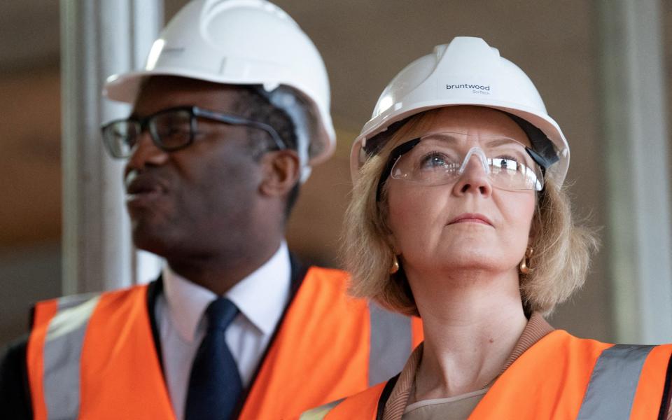 FILE PHOTO: British Prime Minister Liz Truss and Chancellor of the Exchequer Kwasi Kwarteng visit a construction site for a medical innovation campus, on day three of the Conservative Party annual conference at the International Convention Centre in Birmingham, Britain October 4, 2022. Stefan Rousseau/Pool via REUTERS/File Photo - Stefan Rousseau/Pool via REUTERS