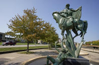 Statues rise from a fountain in a park adjacent to Volker Road Thursday, Sept. 24, 2020, in Kansas City, Mo. The stretch of road, along with parts of two other streets, would be renamed to honor Rev. Martin Luther King Jr. under a city proposal coming in the wake of failed effort to honor King last year. (AP Photo/Charlie Riedel)