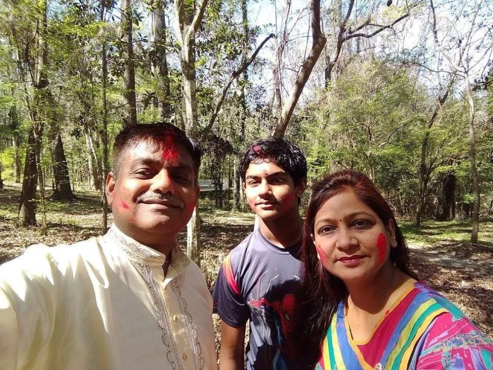 Hindu family of Santosh Dixit, Anjali Awasthi, and son, Shubham at local Holi Festival of Colors.